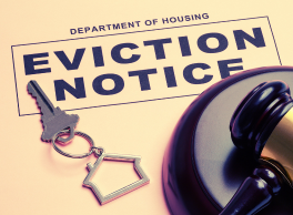 Eviction notice with a keychain and gavel.