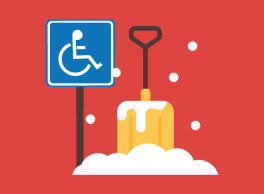 Shovel and snow pile next to sign with the international symbol of accessibility