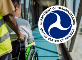 An airport attendant pushes a person in their wheelchair. U.S. Department of Transportation Official Seal.