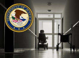 Official Seal of the Department of Justice over the darkened hallway of an institution where a wheelchair and walker sit abandoned.